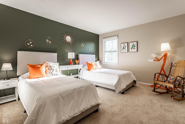 bedroom featuring baseboards and carpet floors