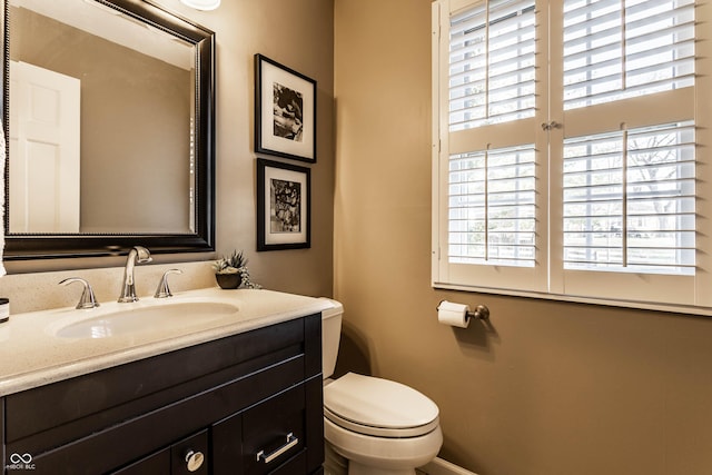 bathroom featuring toilet and vanity