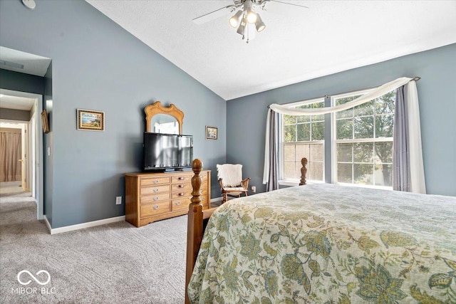 carpeted bedroom with ceiling fan, a textured ceiling, baseboards, and lofted ceiling