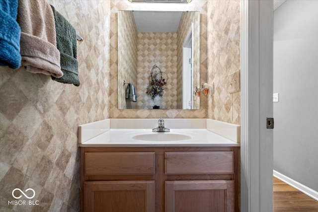 bathroom with vanity and baseboards