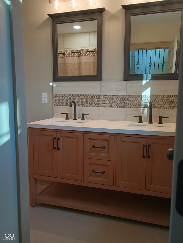 5603 S Randolph St, Indianapolis, IN 46227 - bathroom with double vanity, tasteful backsplash, and a sink
