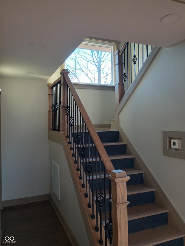 5603 S Randolph St, Indianapolis, IN 46227 - stairs featuring baseboards, visible vents, and wood finished floors