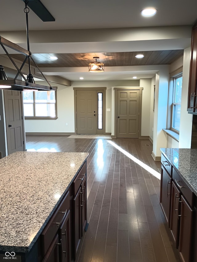 5603 S Randolph St, Indianapolis, IN 46227 - kitchen with baseboards, dark wood-style flooring, open floor plan, and plenty of natural light