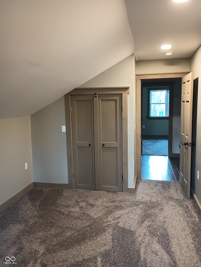 5603 S Randolph St, Indianapolis, IN 46227 - bonus room with carpet flooring, tile patterned floors, vaulted ceiling, and baseboards