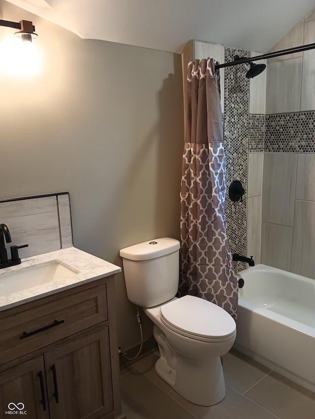 5603 S Randolph St, Indianapolis, IN 46227 - bathroom with lofted ceiling, toilet, shower / bath combination with curtain, tile patterned flooring, and vanity