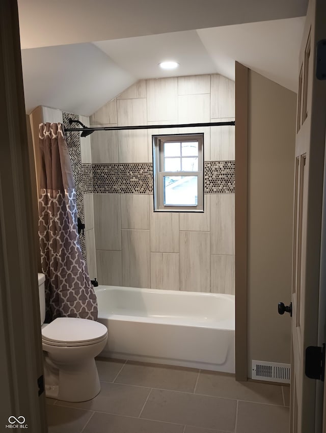 5603 S Randolph St, Indianapolis, IN 46227 - bathroom with vaulted ceiling, toilet, visible vents, and tile patterned floors