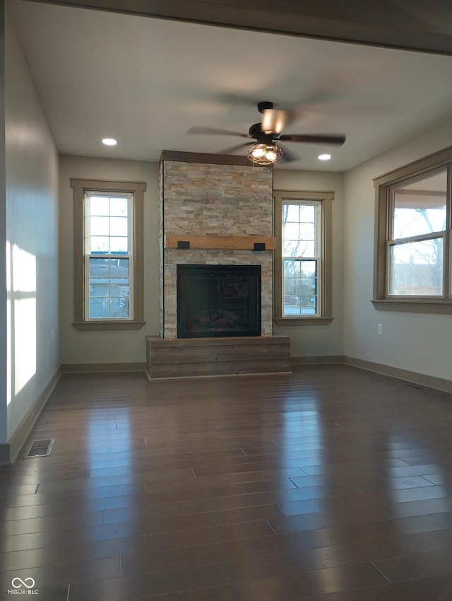 5603 S Randolph St, Indianapolis, IN 46227 - unfurnished living room with baseboards, ceiling fan, a healthy amount of sunlight, and visible vents