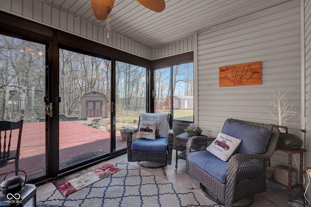 sunroom featuring a ceiling fan