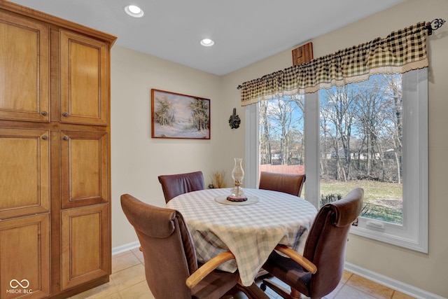 dining room with light tile patterned flooring, recessed lighting, and baseboards