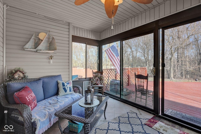 sunroom featuring a ceiling fan