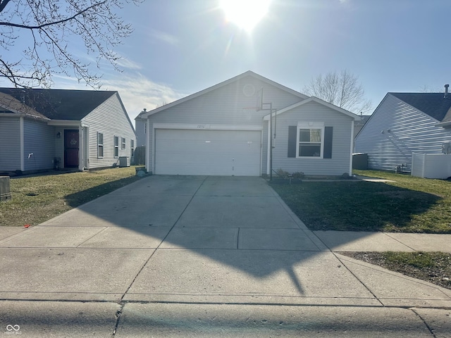 single story home with a front lawn, an attached garage, central AC, and driveway