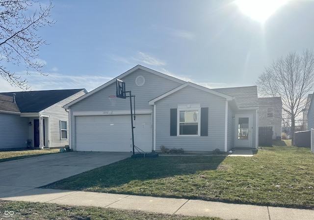 ranch-style house featuring a front lawn, an attached garage, and driveway