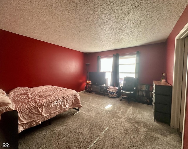 carpeted bedroom with a textured ceiling