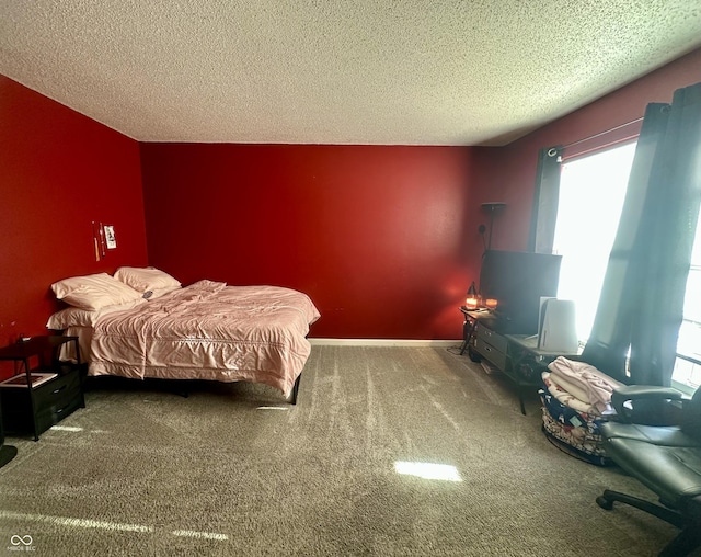 bedroom with baseboards, carpet floors, a textured ceiling, and an accent wall