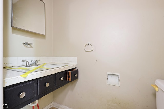 bathroom with toilet and vanity