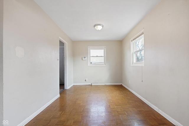 empty room featuring baseboards