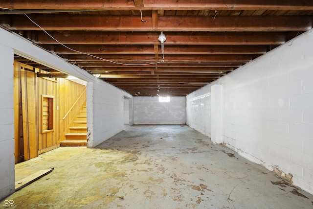 basement featuring stairs