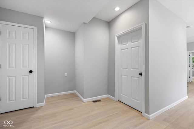 interior space with recessed lighting, visible vents, baseboards, and light wood-style flooring