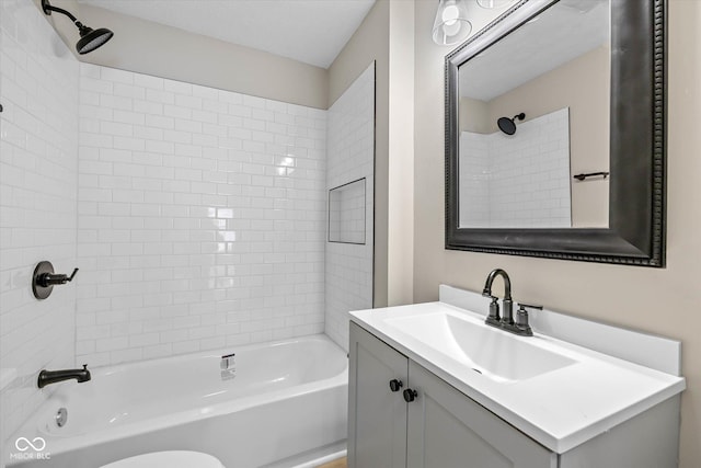 full bath featuring vanity and bathing tub / shower combination