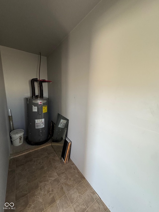 utility room featuring water heater