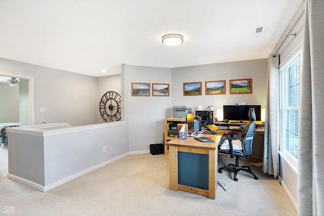 home office with visible vents, light colored carpet, and baseboards