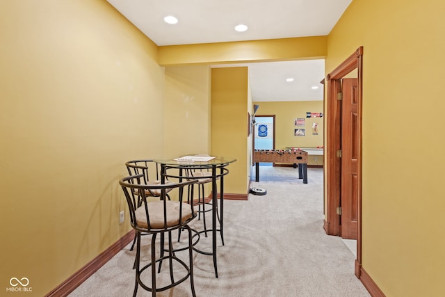 dining area featuring recessed lighting, baseboards, and light carpet