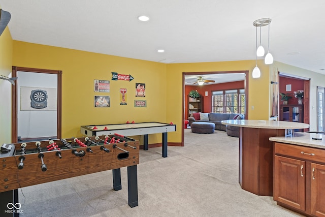 rec room with recessed lighting, baseboards, light colored carpet, and a ceiling fan