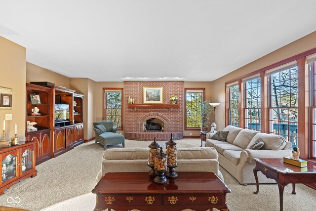 carpeted living area with a fireplace and baseboards