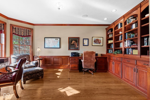 home office featuring light wood-style floors and ornamental molding