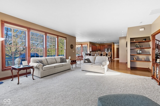 living room with recessed lighting, baseboards, and stairs