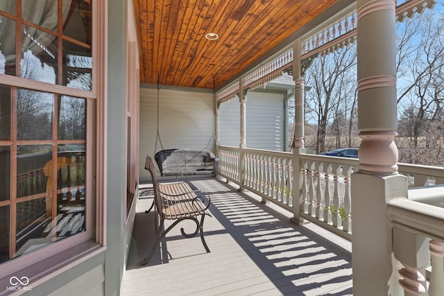 wooden terrace with a porch