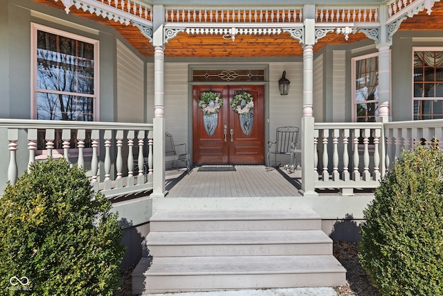 entrance to property featuring covered porch
