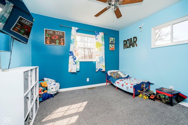 bedroom with baseboards, carpet, and a ceiling fan