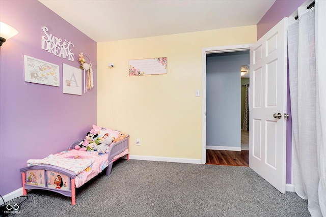 unfurnished bedroom featuring baseboards and carpet floors