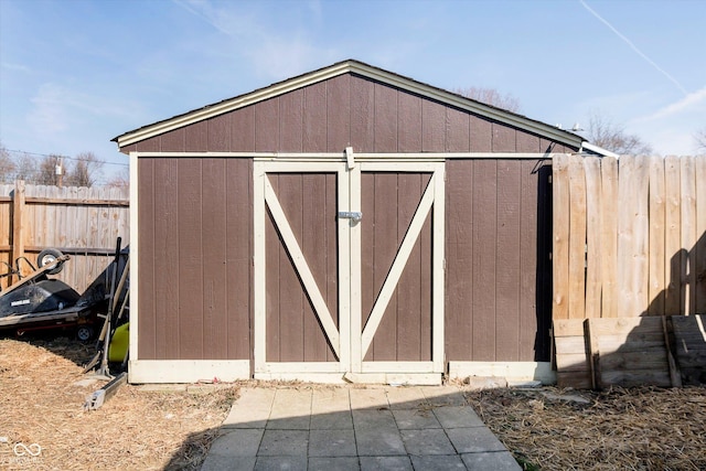 view of shed with fence