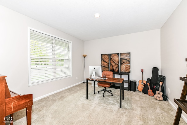 carpeted office space with baseboards