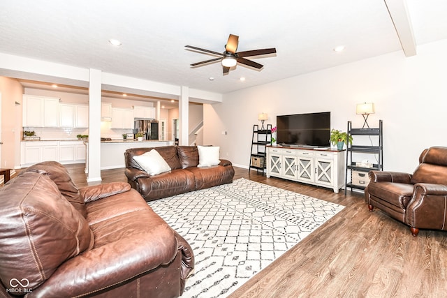 living area featuring recessed lighting, wood finished floors, baseboards, and ceiling fan