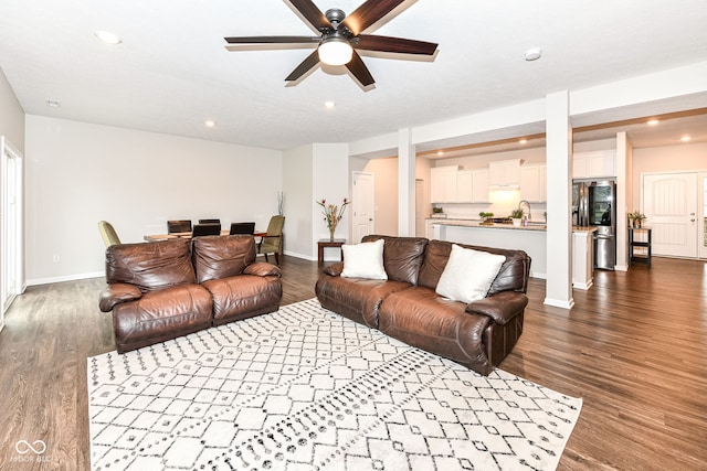 living room featuring dark wood finished floors, recessed lighting, baseboards, and ceiling fan