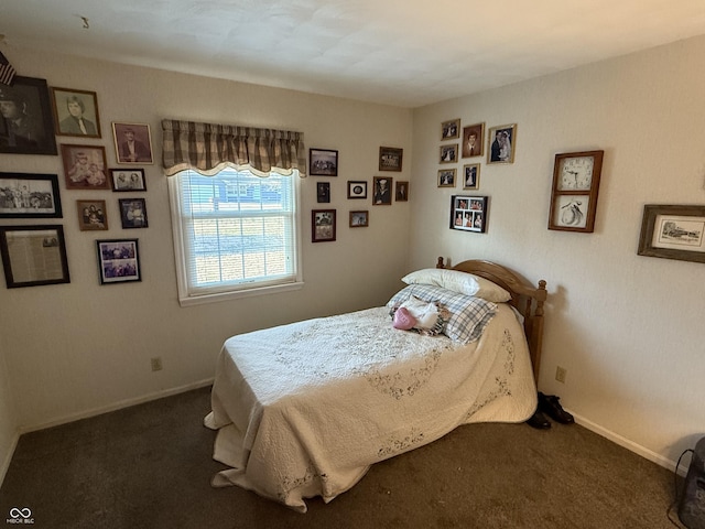 bedroom with baseboards and carpet floors