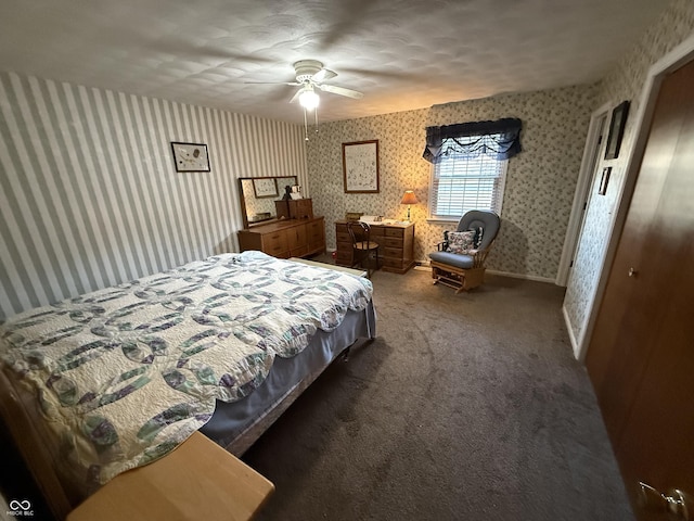 carpeted bedroom with baseboards, ceiling fan, and wallpapered walls