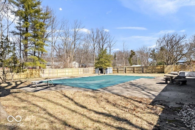 view of pool with a patio, a fenced backyard, and a fenced in pool