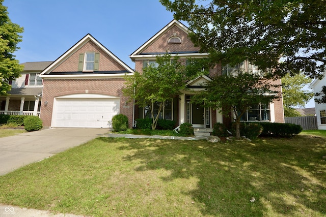 traditional home with a garage, driveway, a front lawn, and fence