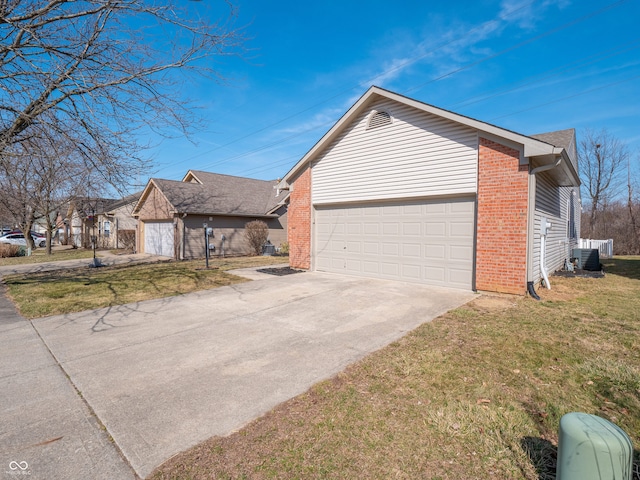 view of property exterior with brick siding, a yard, central AC, and a garage