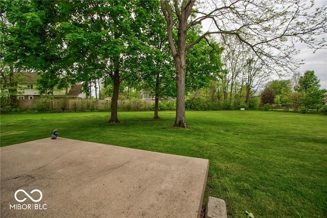 view of yard featuring a patio and fence