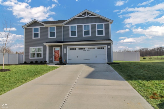 view of front of property with a garage, driveway, a front yard, and fence