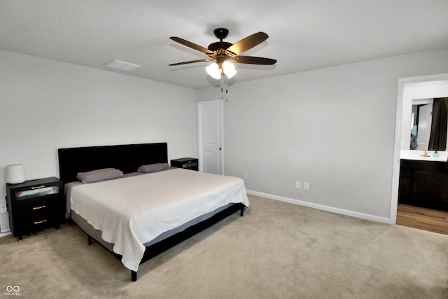 bedroom with visible vents, connected bathroom, carpet floors, baseboards, and ceiling fan