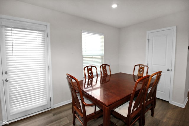 dining room with recessed lighting, baseboards, and wood finished floors