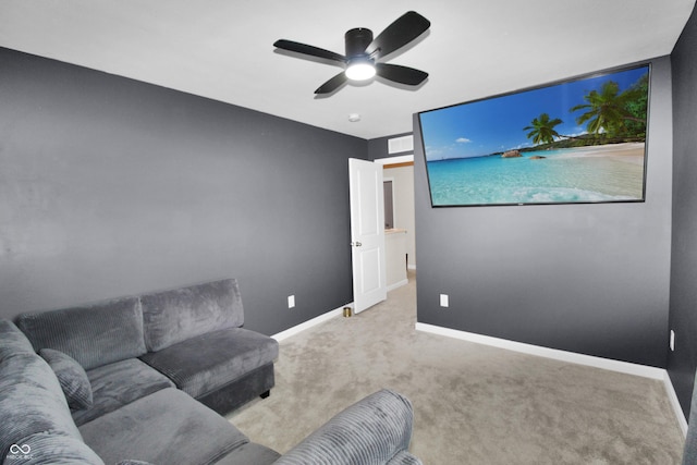 living area with baseboards, carpet floors, and ceiling fan