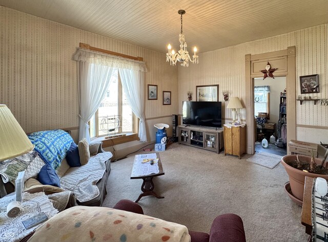 5395 W State Road 38, New Castle, IN 47362 - living room with carpet floors, an inviting chandelier, and wallpapered walls