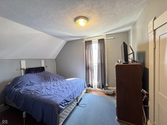 5395 W State Road 38, New Castle, IN 47362 - carpeted bedroom with a textured ceiling and vaulted ceiling